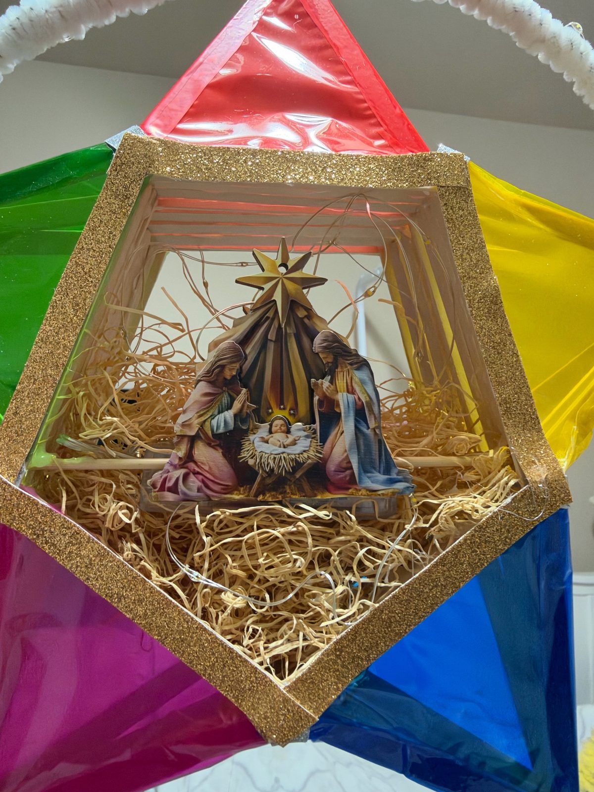 Close-up of the nativity scene inside a handmade parol
